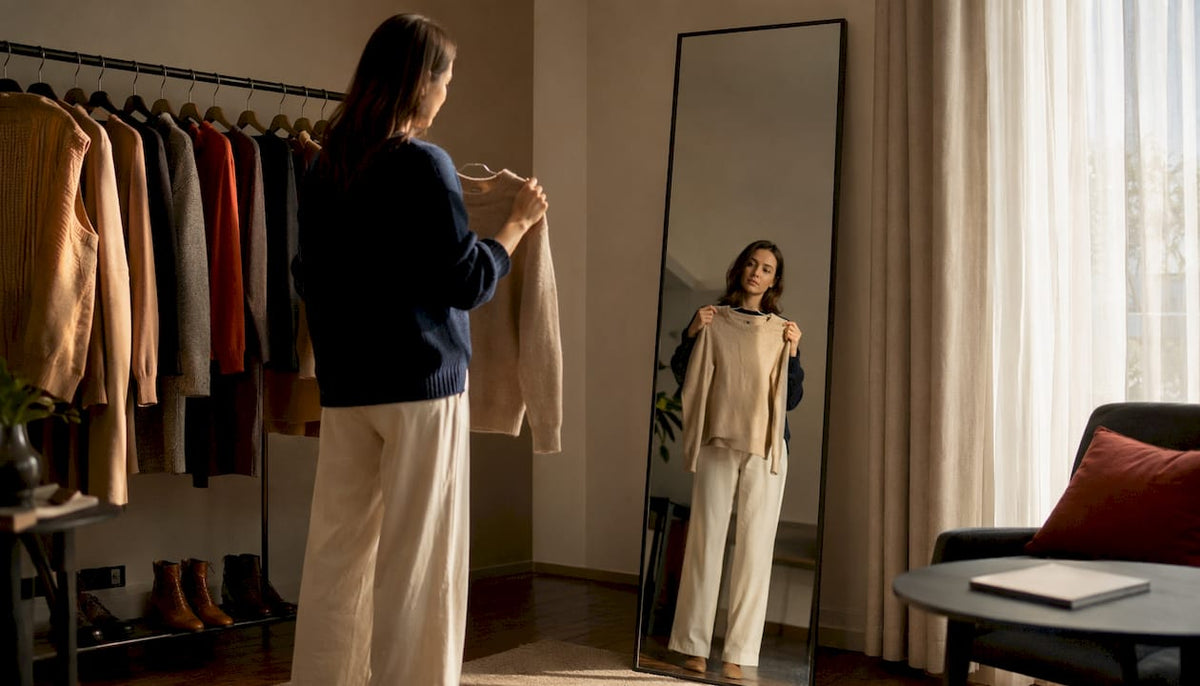 Woman selecting capsule wardrobe clothing